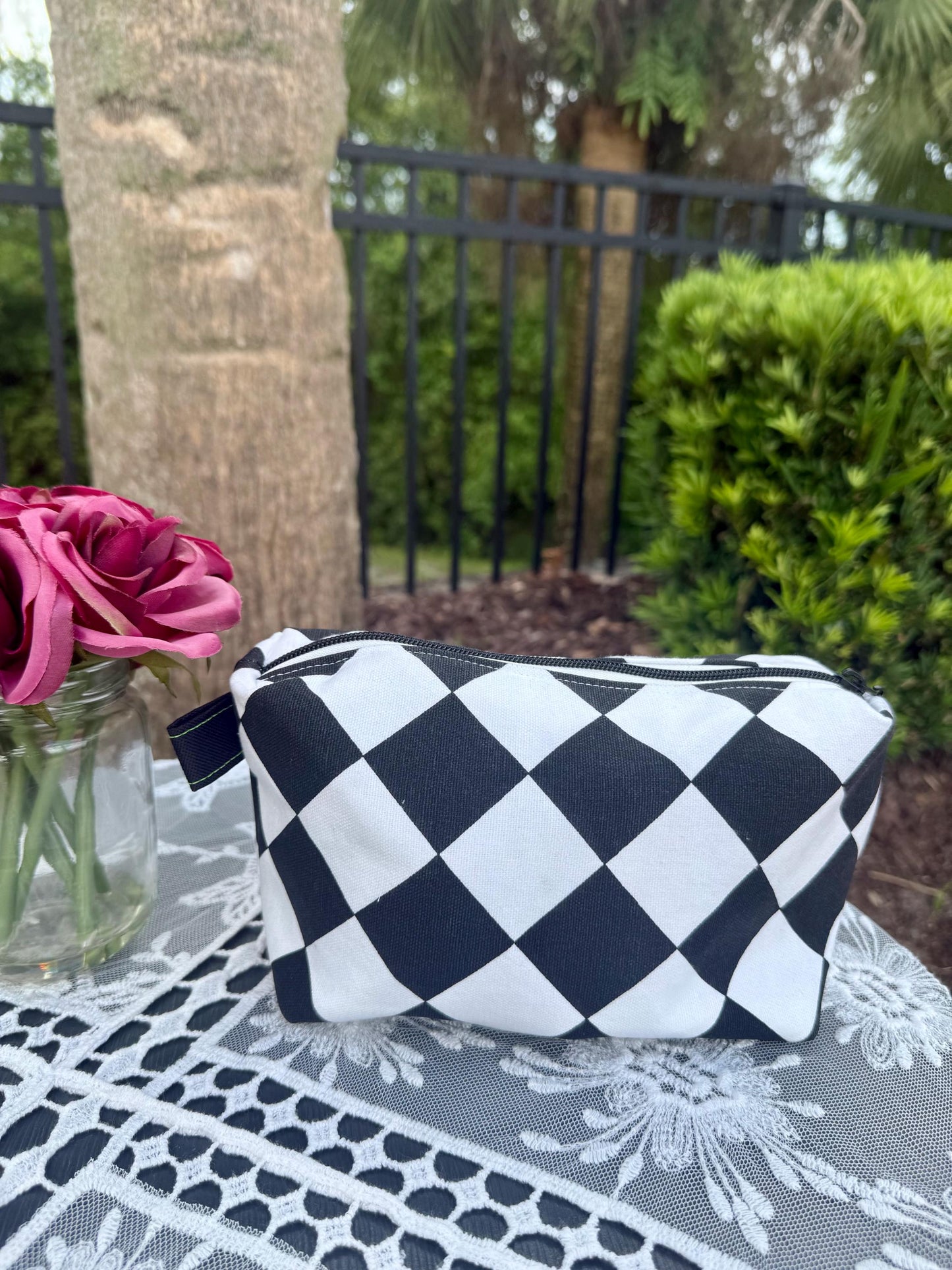 Cosmetic box pouch, green fabric lining with ladybugs, black and white zippered pouch