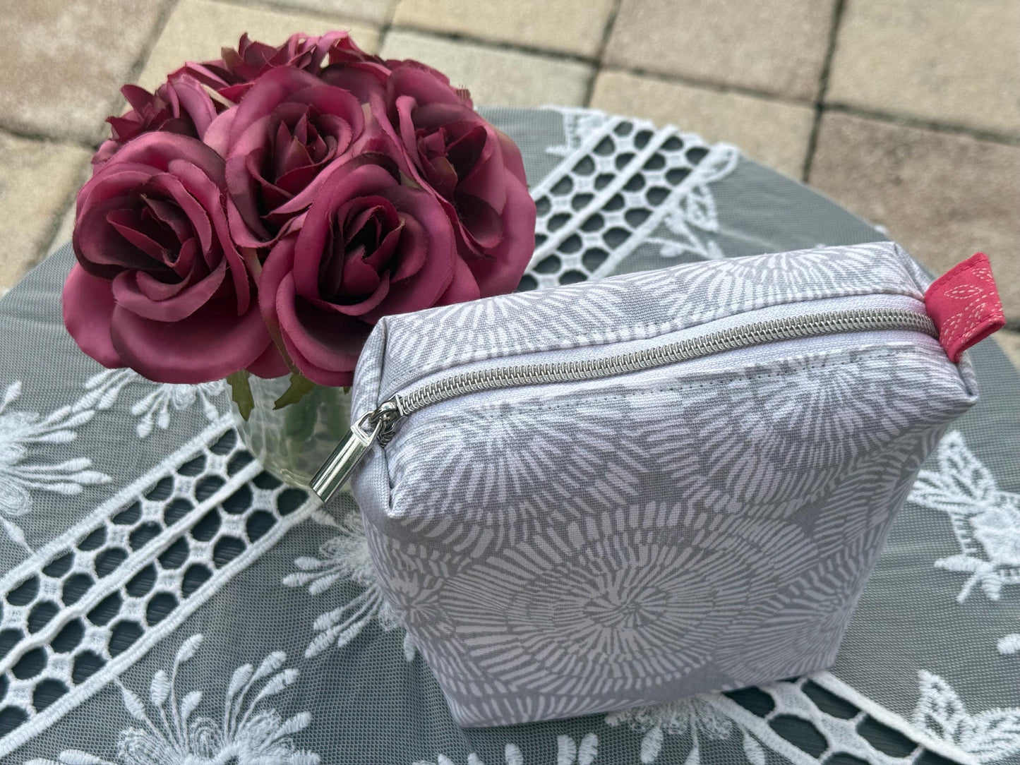 Purse storage bag, toiletry bag, cream color with pink lining fabric. Perfect for a travel bag to keep in your car or your purse